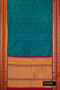 Peacock Blue Dual Tone Kanchipuram Silk Saree with Zari Butta on the body and Fancy Border.  displayed on a mannequin