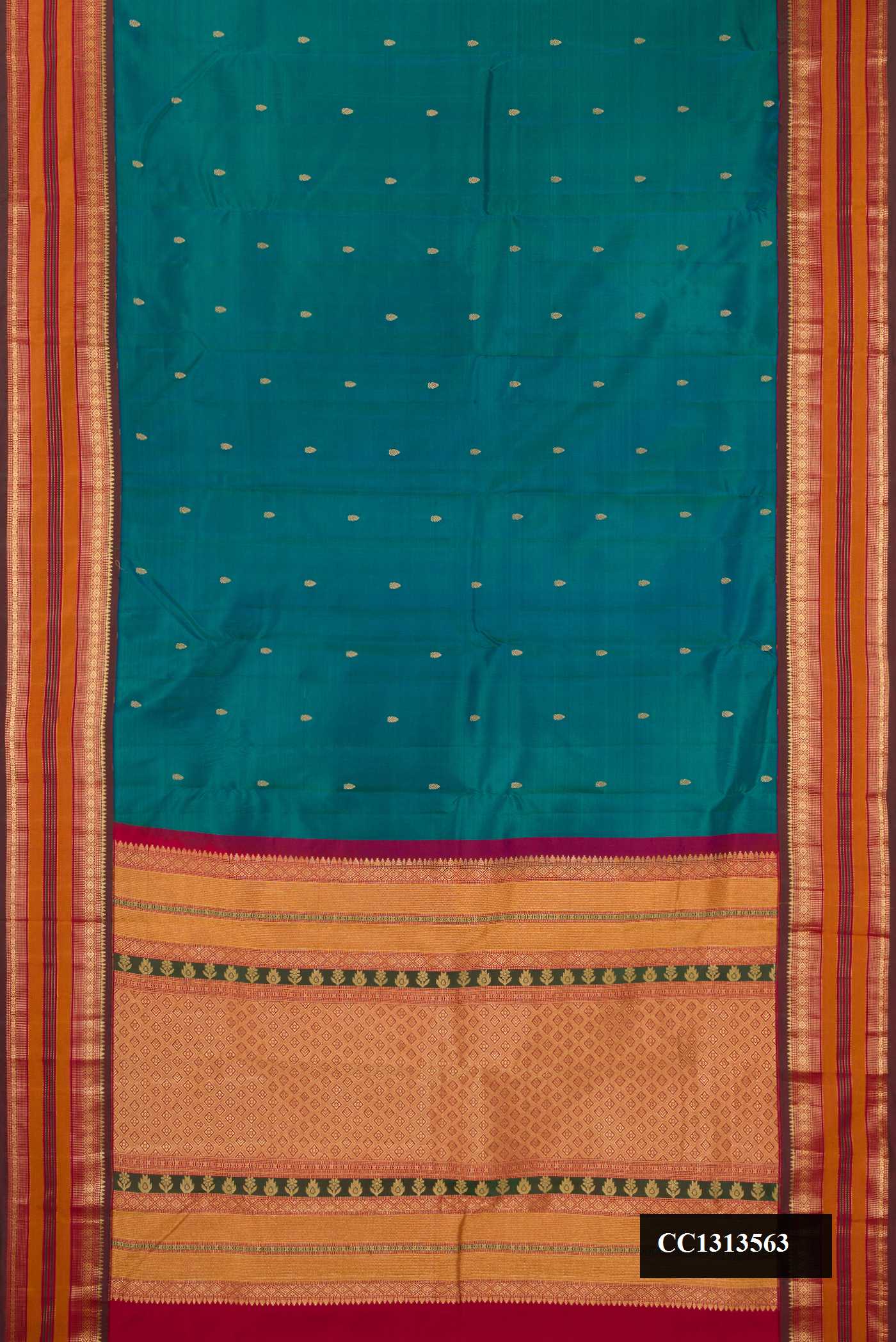 Peacock Blue Dual Tone Kanchipuram Silk Saree with Zari Butta on the body and Fancy Border.  displayed on a mannequin
