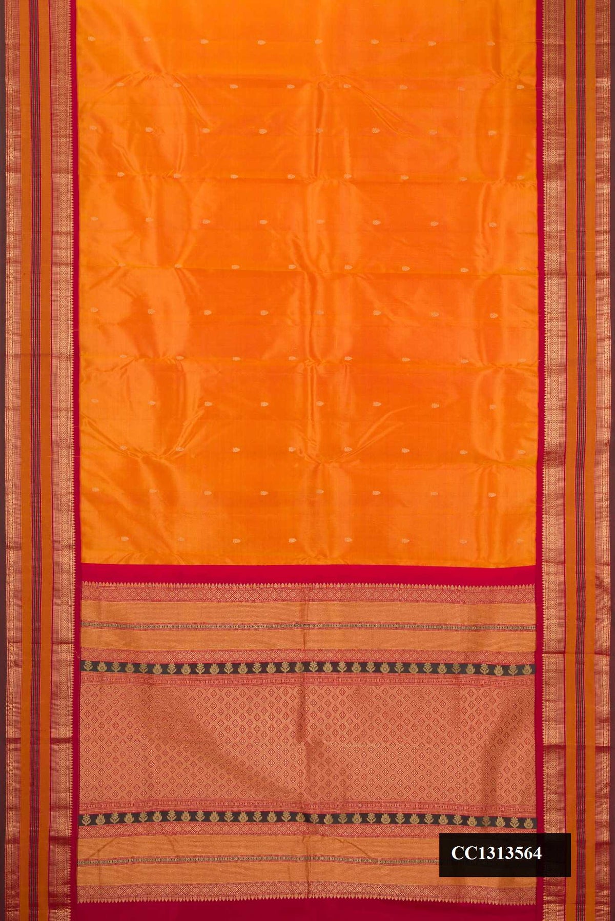 Mustard Dual Tone Kanchipuram Silk Saree with Zari Butta on the body and Fancy Border.  displayed on a mannequin
