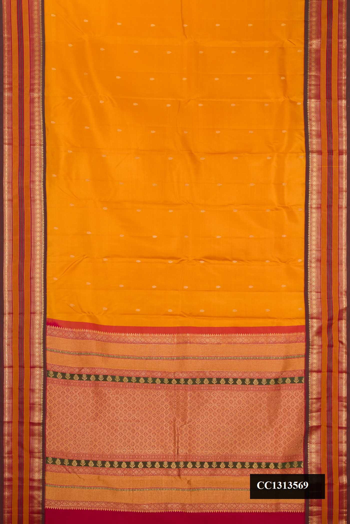 Mustard Dual Tone Kanchipuram Silk Saree with Zari Butta on the body and Fancy Border.  displayed on a mannequin