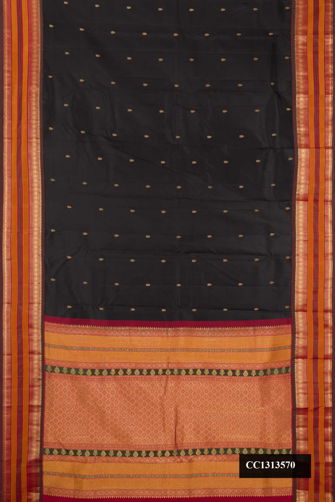 Black Dual Tone Kanchipuram Silk Saree with Zari Butta on the body and Fancy Border.  displayed on a mannequin