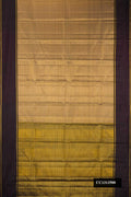Gold Dual Tone Kanchipuram Silk Saree with Stripes on the body and Zari Border.  displayed on a mannequin