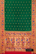 Bottle Green Dual Tone Paithani Silk Saree with Zari Butta on the body and Paithani Border.  displayed on a mannequin