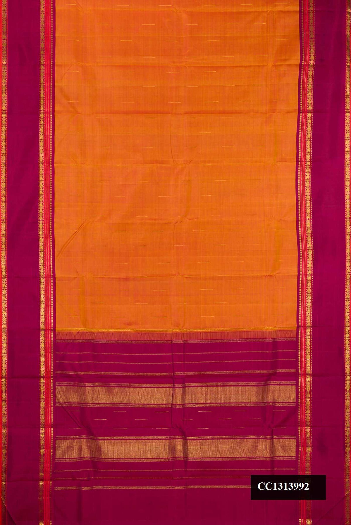 Mustard Dual Tone Kanchipuram Silk Saree with Zari Butta on the body and Zari Border.  displayed on a mannequin