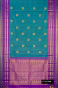 Peacock Blue Dual Tone Kanchipuram Silk Saree with Stripes on the body and Fancy Border.  displayed on a mannequin