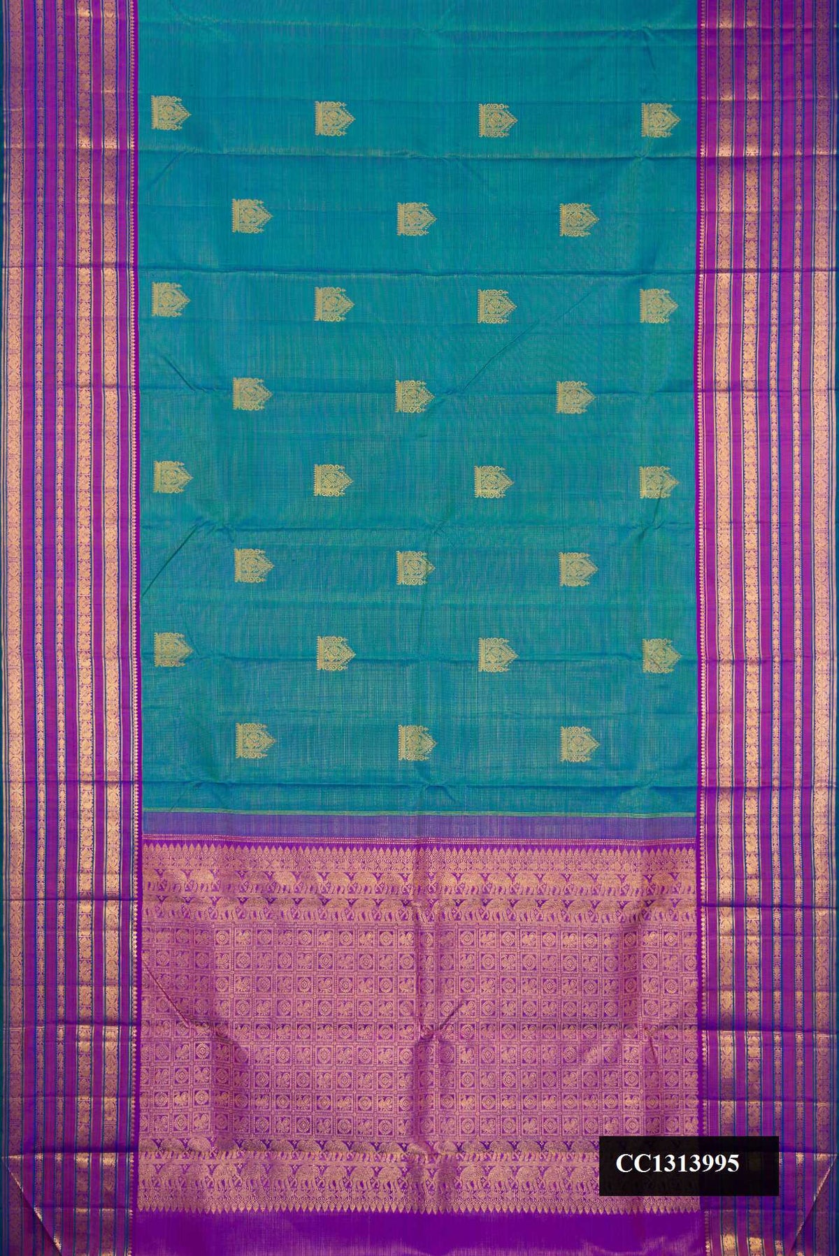 Peacock Blue Dual Tone Kanchipuram Silk Saree with Stripes on the body and Fancy Border.  displayed on a mannequin