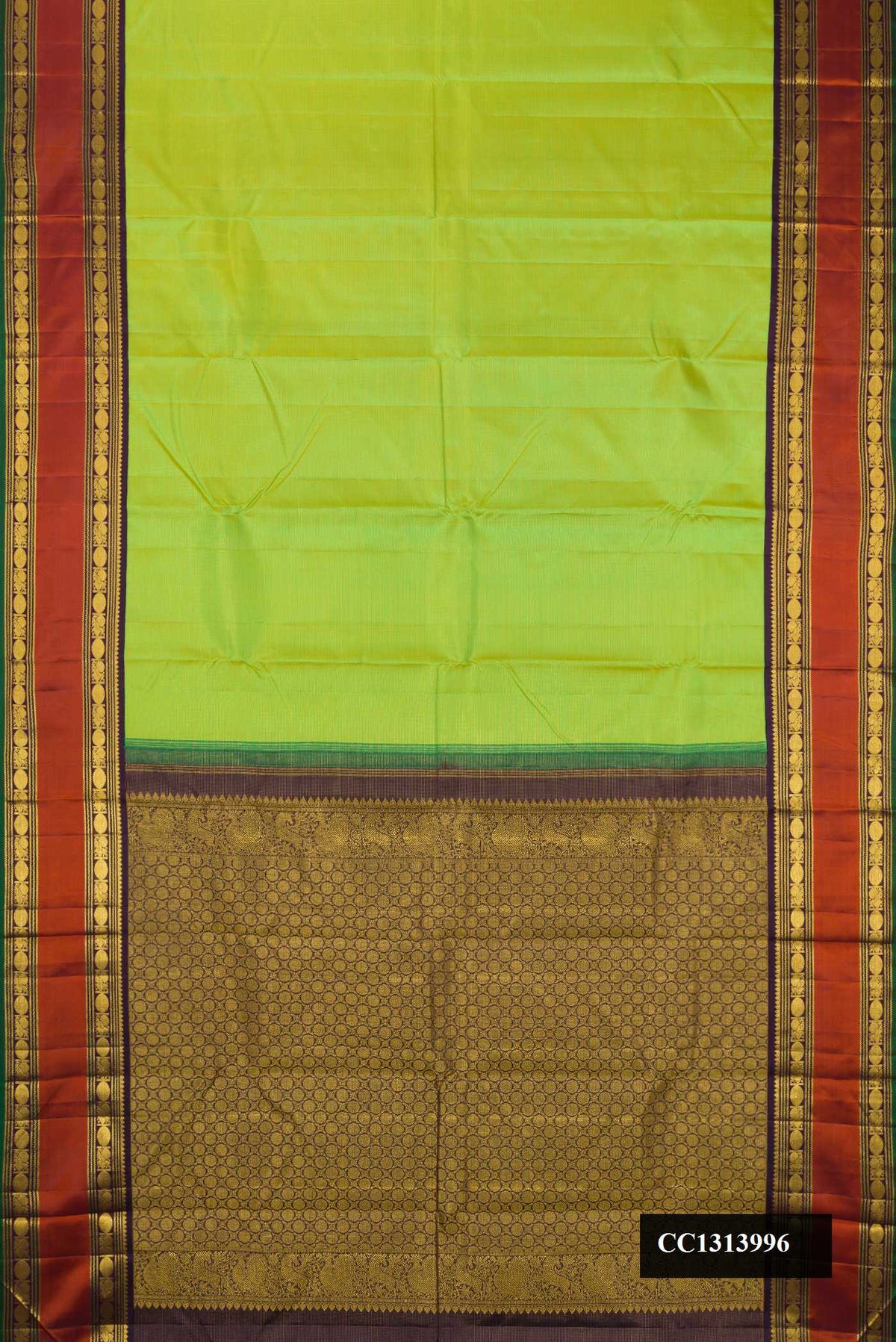 Parrot Green Dual Tone Kanchipuram Silk Saree with Stripes on the body and Zari Border.  displayed on a mannequin