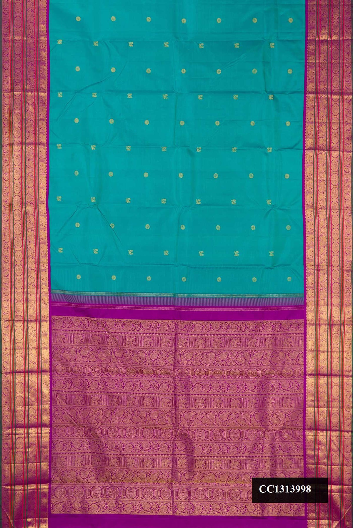 Sea Green Dual Tone Kanchipuram Silk Saree with Zari Butta on the body and Zari Border.  displayed on a mannequin