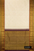 Pista Green Dual Tone Kanchipuram Silk Saree with Zari Butta on the body and Fancy Border.  displayed on a mannequin