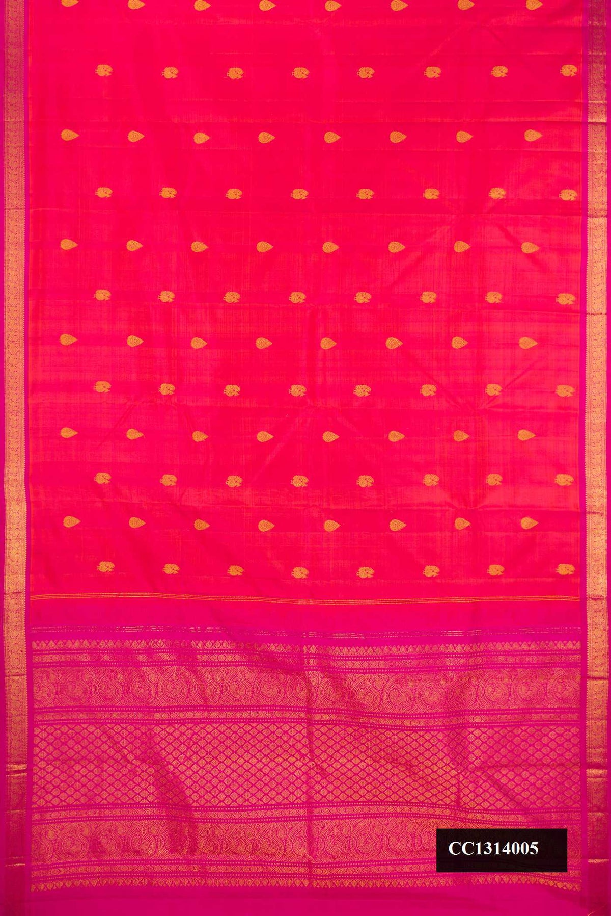 Coral Dual Tone Kanchipuram Silk Saree with Zari Butta on the body and Zari Border.  displayed on a mannequin