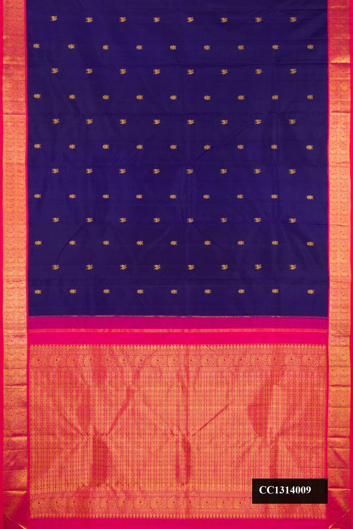 Navy Blue Dual Tone Kanchipuram Silk Saree with Zari Butta on the body and Zari Border.  displayed on a mannequin