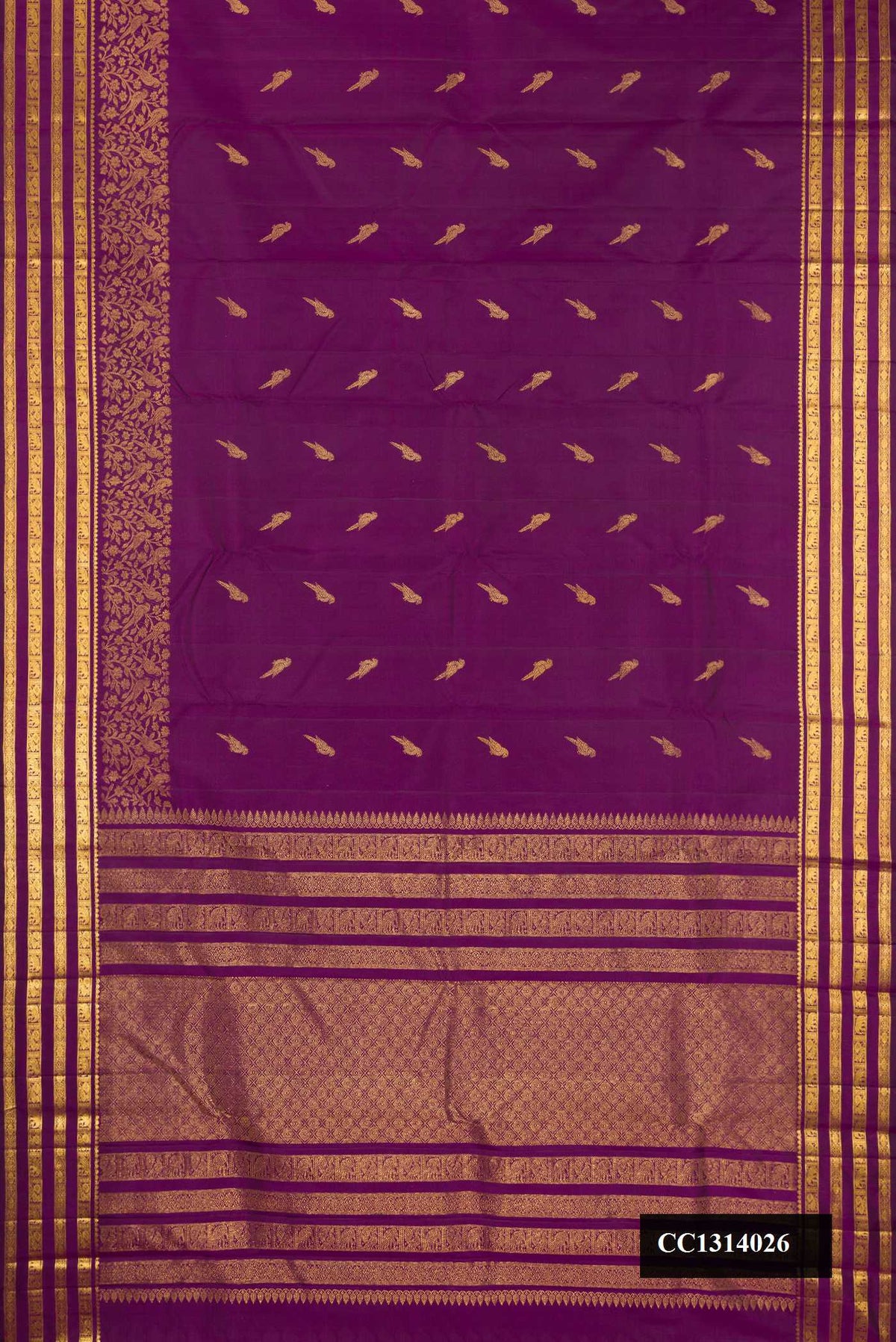 Purple Dual Tone Kanchipuram Silk Saree with Zari Butta on the body and Fancy Border.  displayed on a mannequin