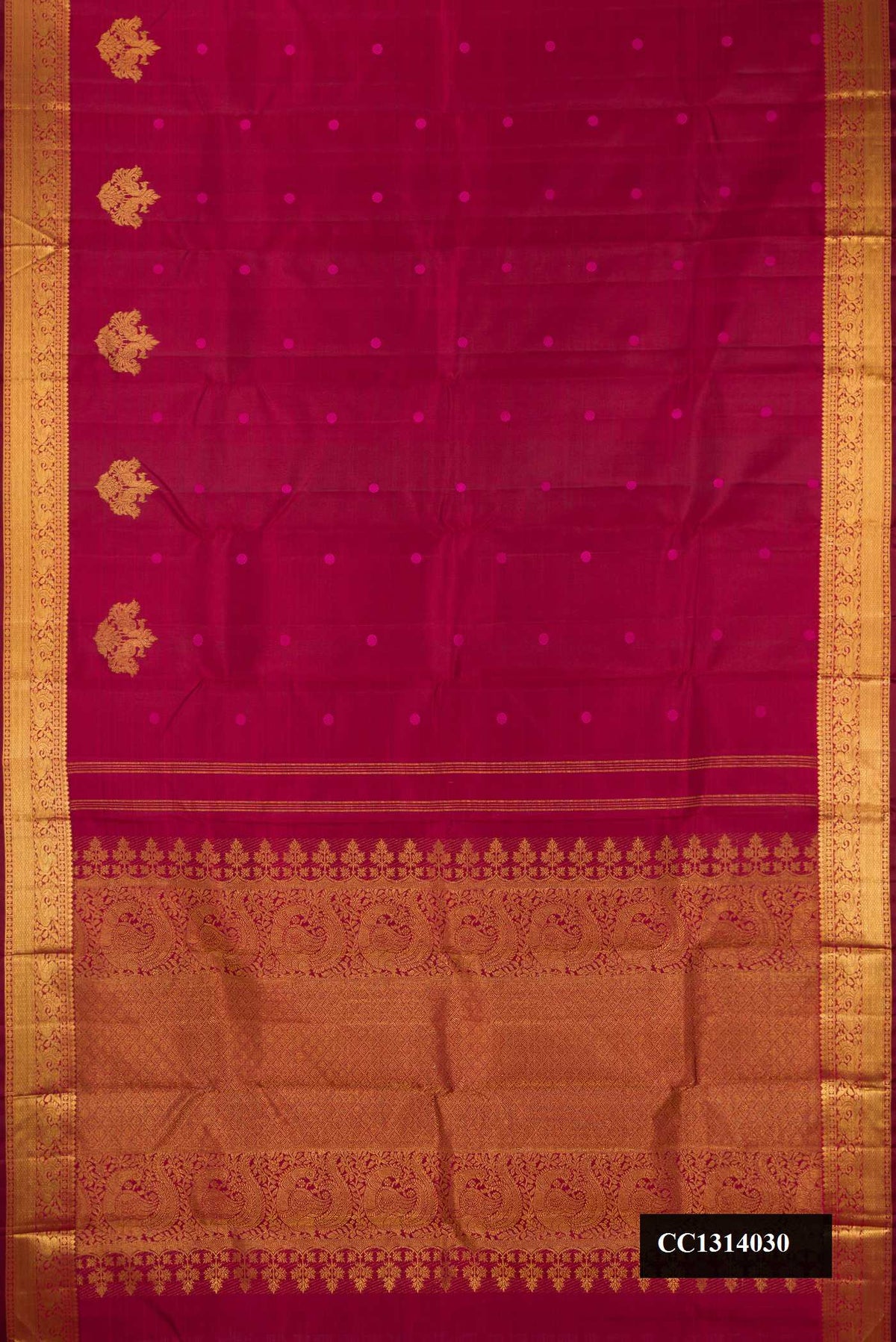 Maroon Dual Tone Kanchipuram Silk Saree with Thread Butta on the body and Zari Border.  displayed on a mannequin