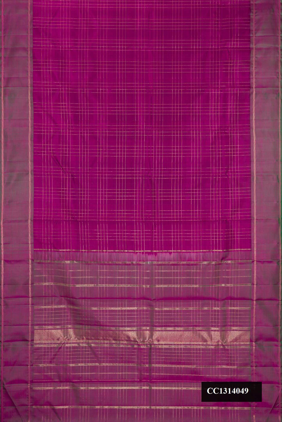 Magenta Dual Tone Kanchipuram Silk Saree with Checked design on the body and Zari Border.  displayed on a mannequin