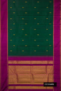 Bottle Green Dual Tone Kanchipuram Silk Saree with Zari Butta on the body and Zari Border.  displayed on a mannequin