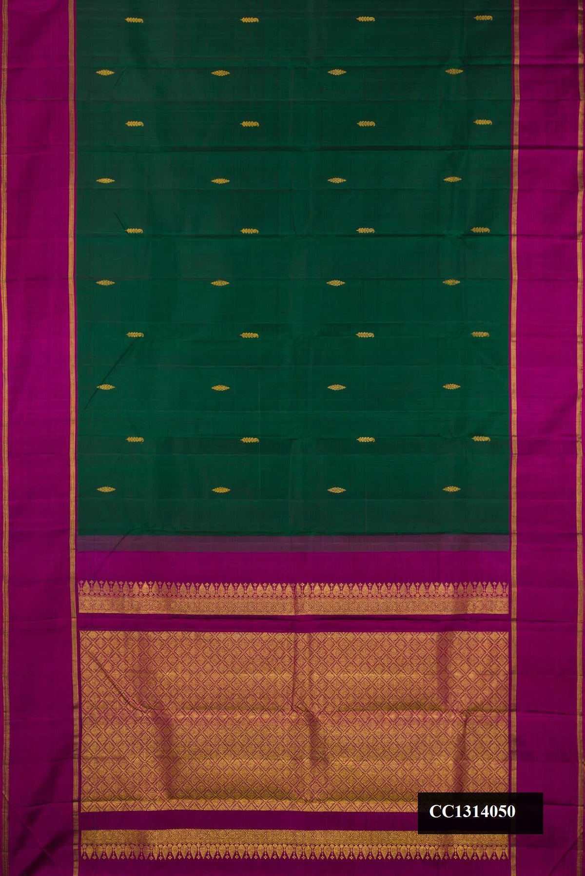 Bottle Green Dual Tone Kanchipuram Silk Saree with Zari Butta on the body and Zari Border.  displayed on a mannequin