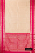 Beige Dual Tone Kanchipuram Silk Saree with Zari Butta on the body and Zari Border.  displayed on a mannequin
