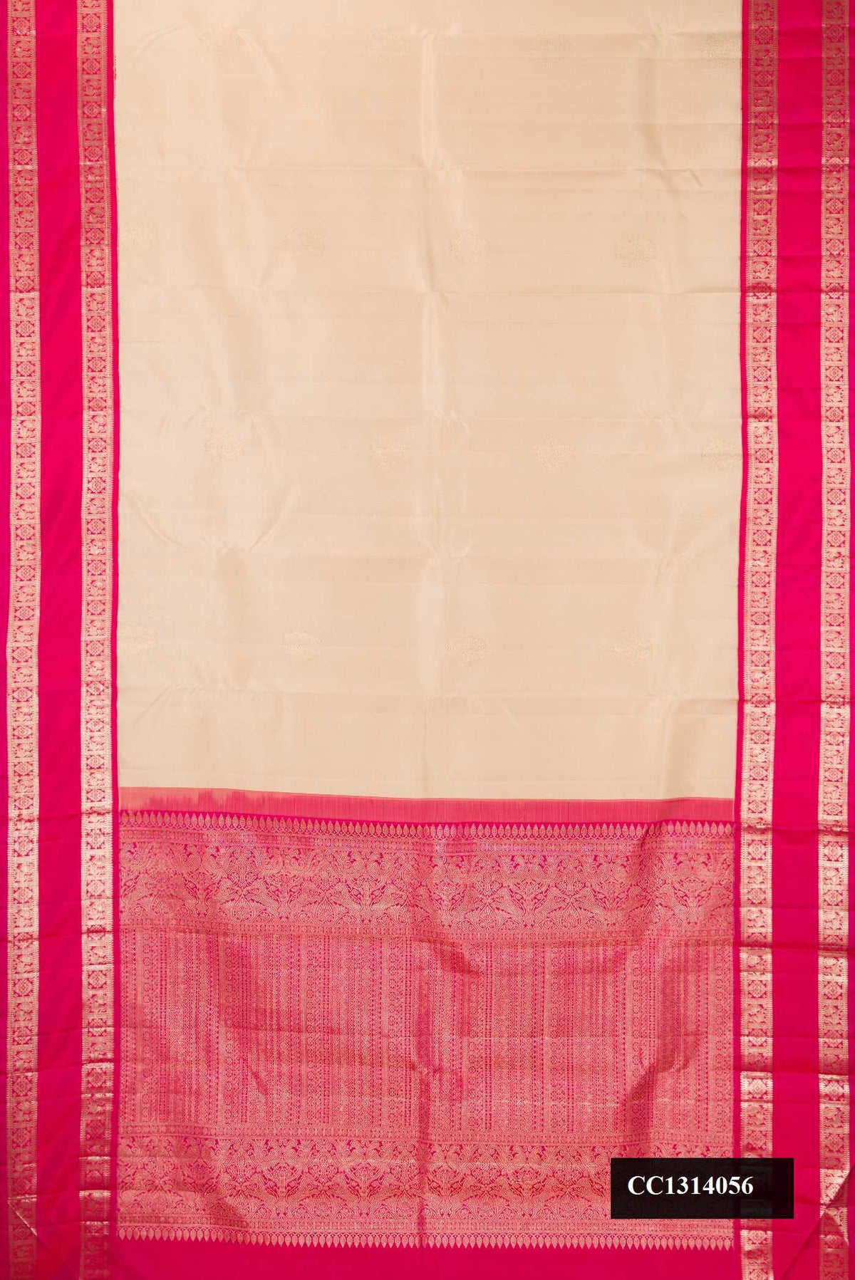 Beige Dual Tone Kanchipuram Silk Saree with Zari Butta on the body and Zari Border.  displayed on a mannequin