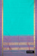 Sea Green Dual Tone Kanchipuram Silk Saree with Plain Body and Zari Border.  displayed on a mannequin