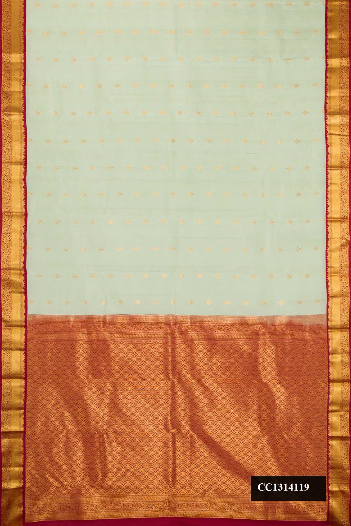 Pista Green Dual Tone Kanchipuram Silk Saree with Zari Butta on the body and Zari Border.  displayed on a mannequin