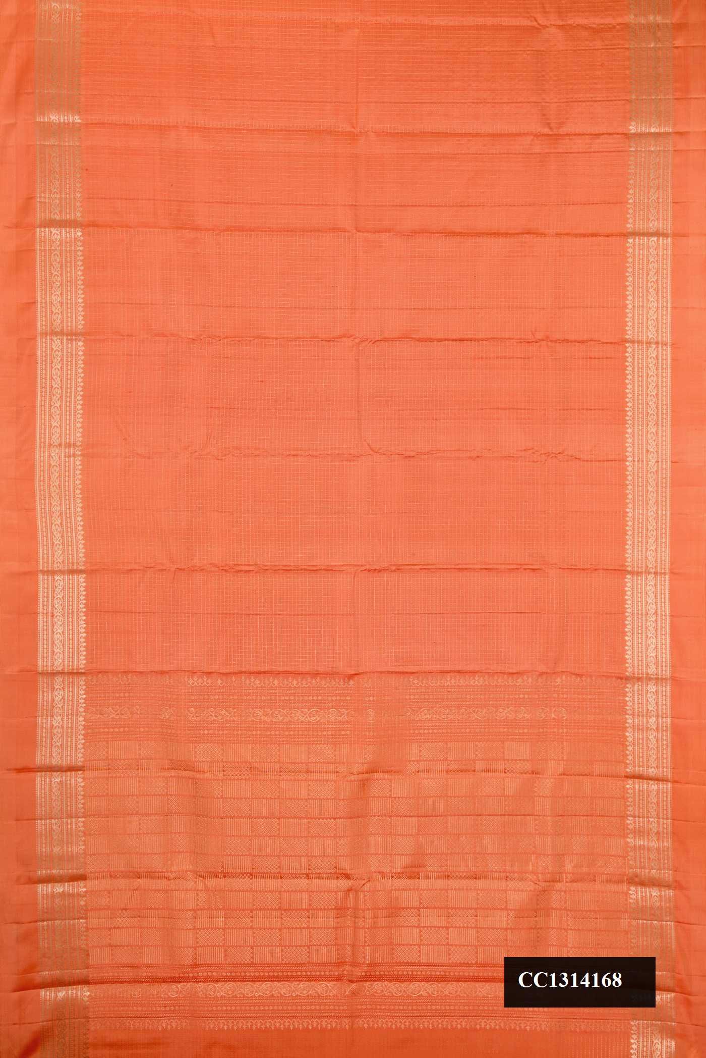 Orange Dual Tone Kanchipuram Silk Saree with Checked design on the body and Zari Border.  displayed on a mannequin