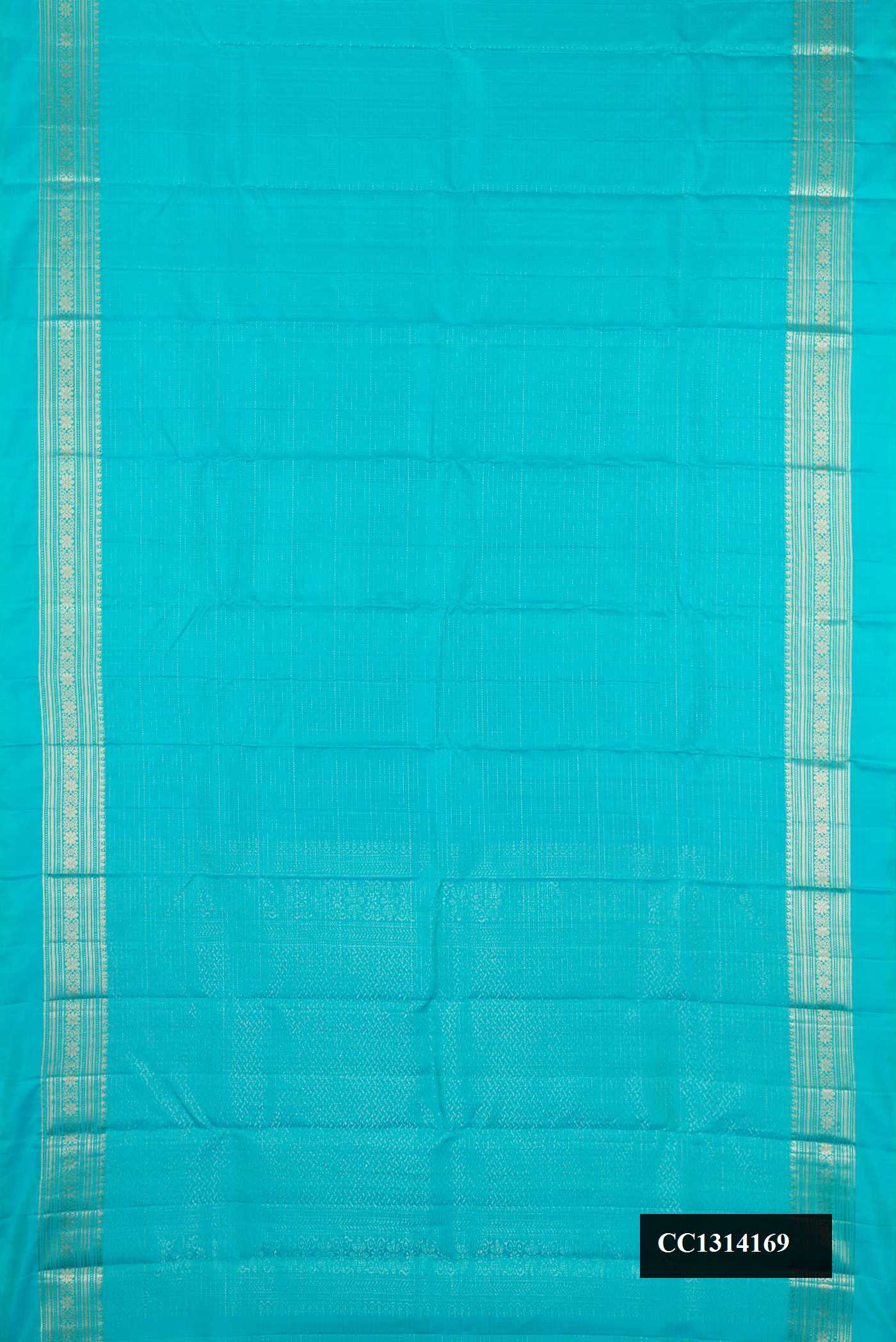 Sky Blue Dual Tone Kanchipuram Silk Saree with Checked design on the body and Zari Border.  displayed on a mannequin