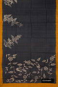 Black Dual Tone Tussar Silk Saree with Printed design on the body and Printed Border.  displayed on a mannequin
