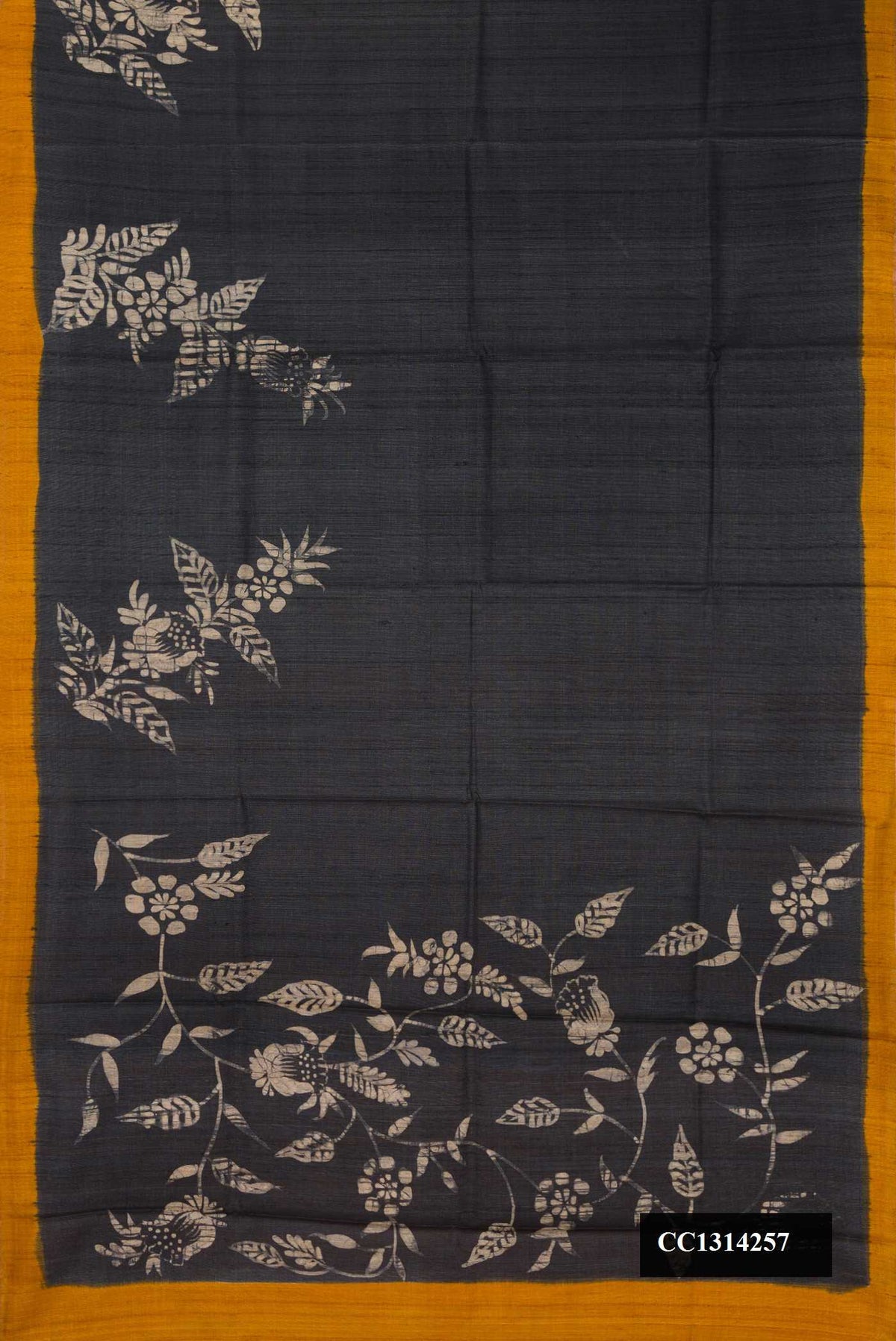 Black Dual Tone Tussar Silk Saree with Printed design on the body and Printed Border.  displayed on a mannequin