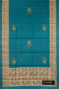 Peacock Blue Dual Tone Tussar Silk Saree with Printed design on the body and Printed Border.  displayed on a mannequin