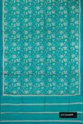 Sky Blue Dual Tone Tussar Silk Saree with Printed design on the body and Embroidery Border.  displayed on a mannequin