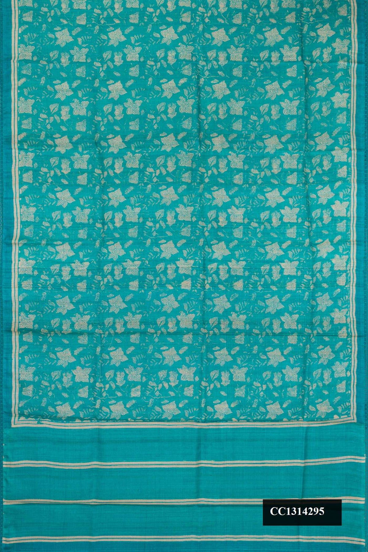 Sky Blue Dual Tone Tussar Silk Saree with Printed design on the body and Embroidery Border.  displayed on a mannequin