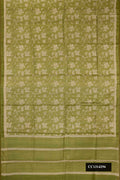 Green Dual Tone Tussar Silk Saree with Printed design on the body and Embroidered Border.  displayed on a mannequin