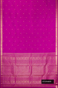 Magenta Dual Tone Kanchipuram Silk Saree with Zari Butta on the body and Zari Border.  displayed on a mannequin