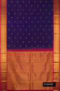 Navy Blue Dual Tone Kanchipuram Silk Saree with Zari Butta on the body and Zari Border.  displayed on a mannequin