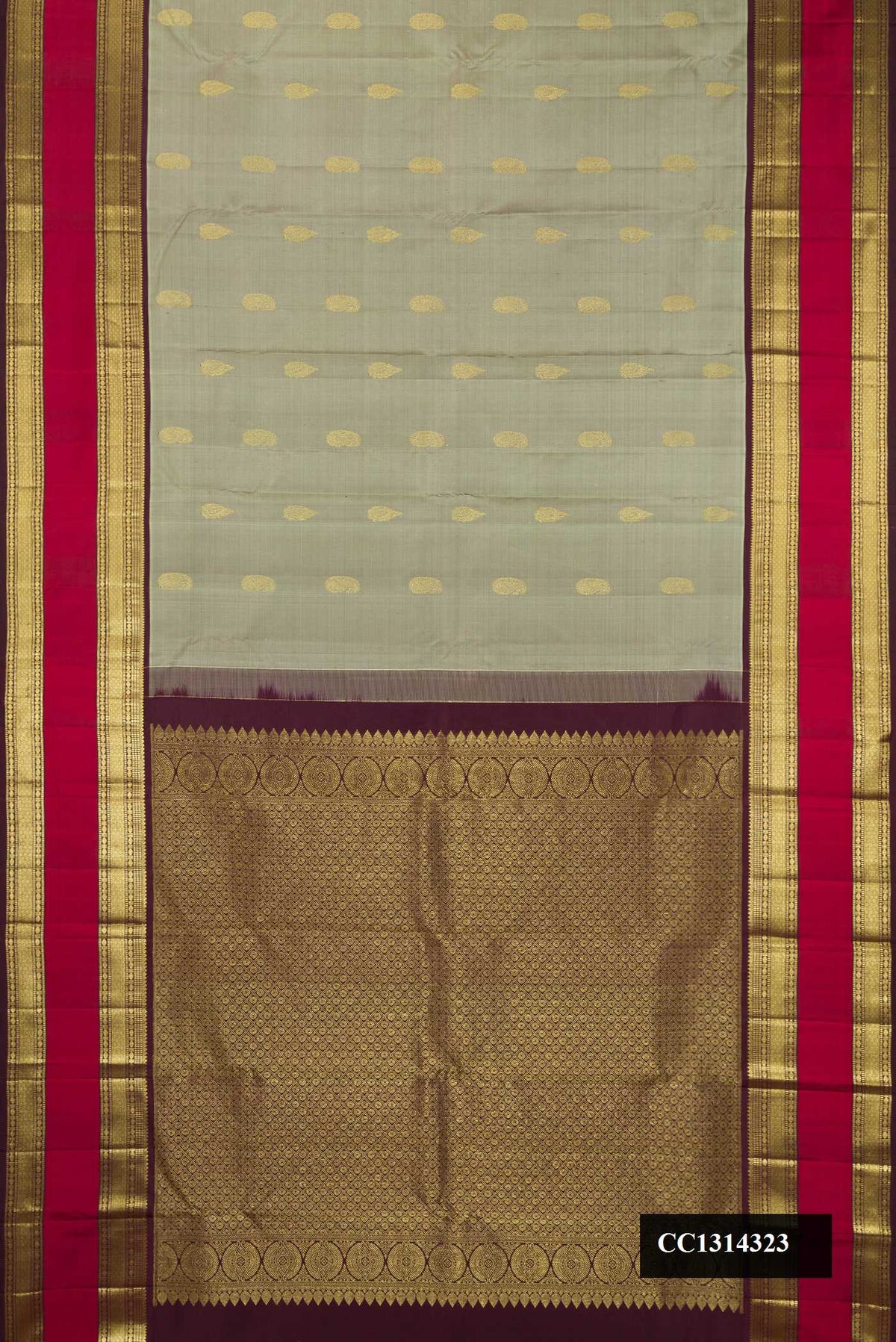 Grey Dual Tone Kanchipuram Silk Saree with Zari Butta on the body and Zari Border.  displayed on a mannequin