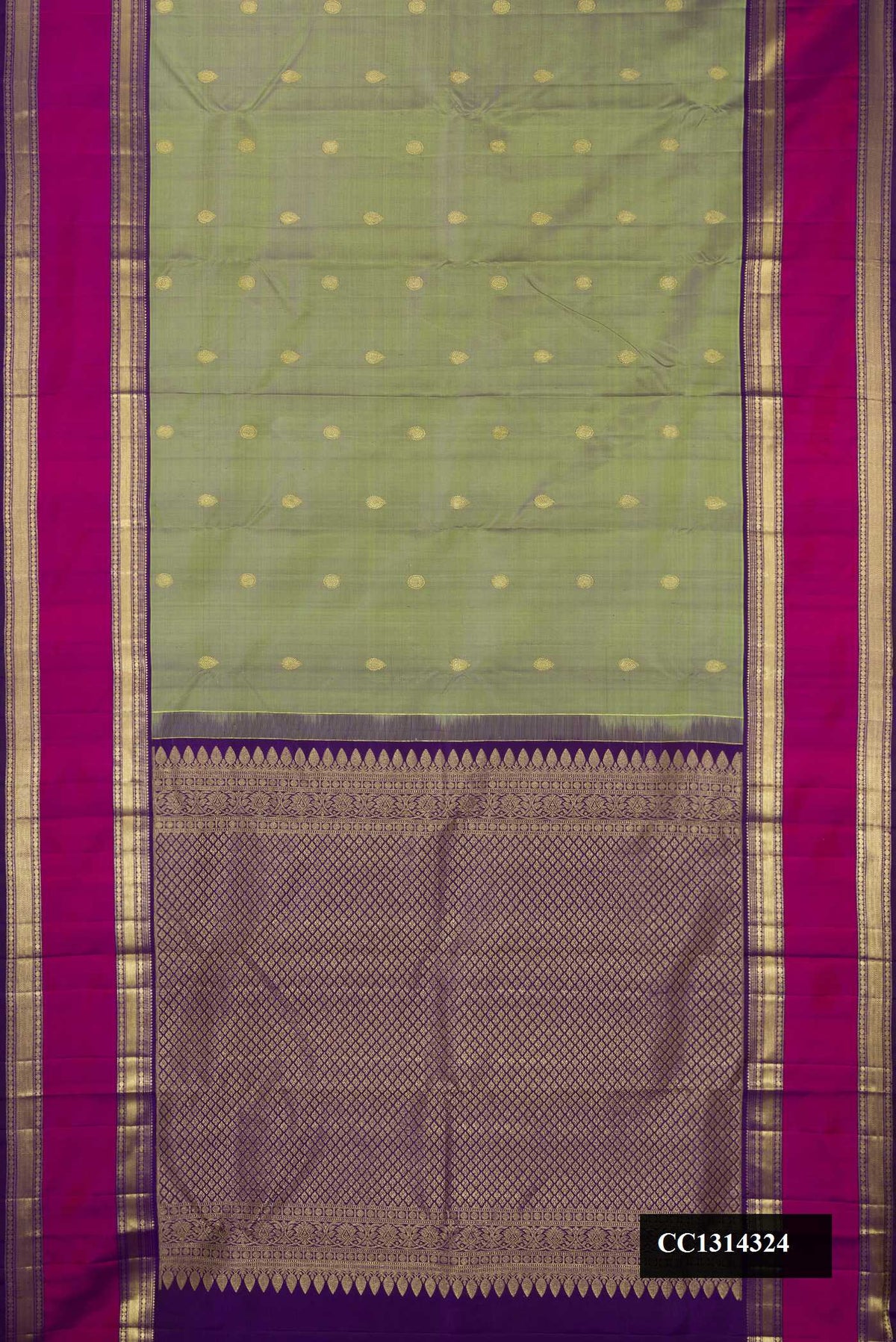 Green Dual Tone Kanchipuram Silk Saree with Zari Butta on the body and Zari Border.  displayed on a mannequin