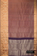 Rust Dual Tone Kanchipuram Tissue Silk Saree with Zari Brocade on the body and Fancy Border.  displayed on a mannequin