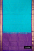 Sky Blue Dual Tone Kanchipuram Silk Saree with Zari Butta on the body and Zari Border.  displayed on a mannequin