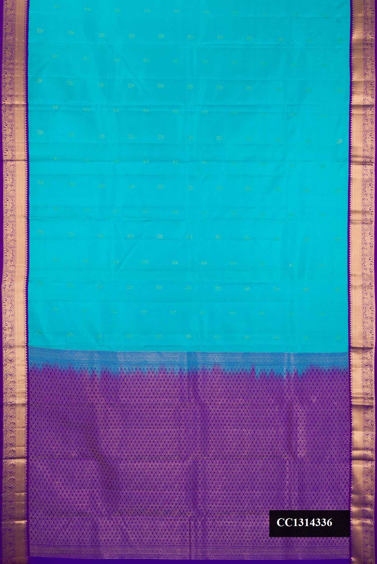 Sky Blue Dual Tone Kanchipuram Silk Saree with Zari Butta on the body and Zari Border.  displayed on a mannequin