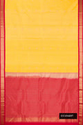 Yellow Dual Tone Kanchipuram Silk Saree with Zari Butta on the body and Zari Border.  displayed on a mannequin