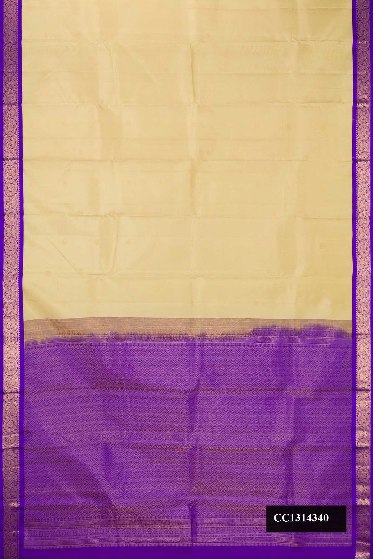 Beige Dual Tone Kanchipuram Silk Saree with Zari Butta on the body and Zari Border.  displayed on a mannequin
