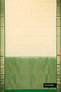Sandal Dual Tone Kanchipuram Silk Saree with Zari Butta on the body and Zari Border.  displayed on a mannequin