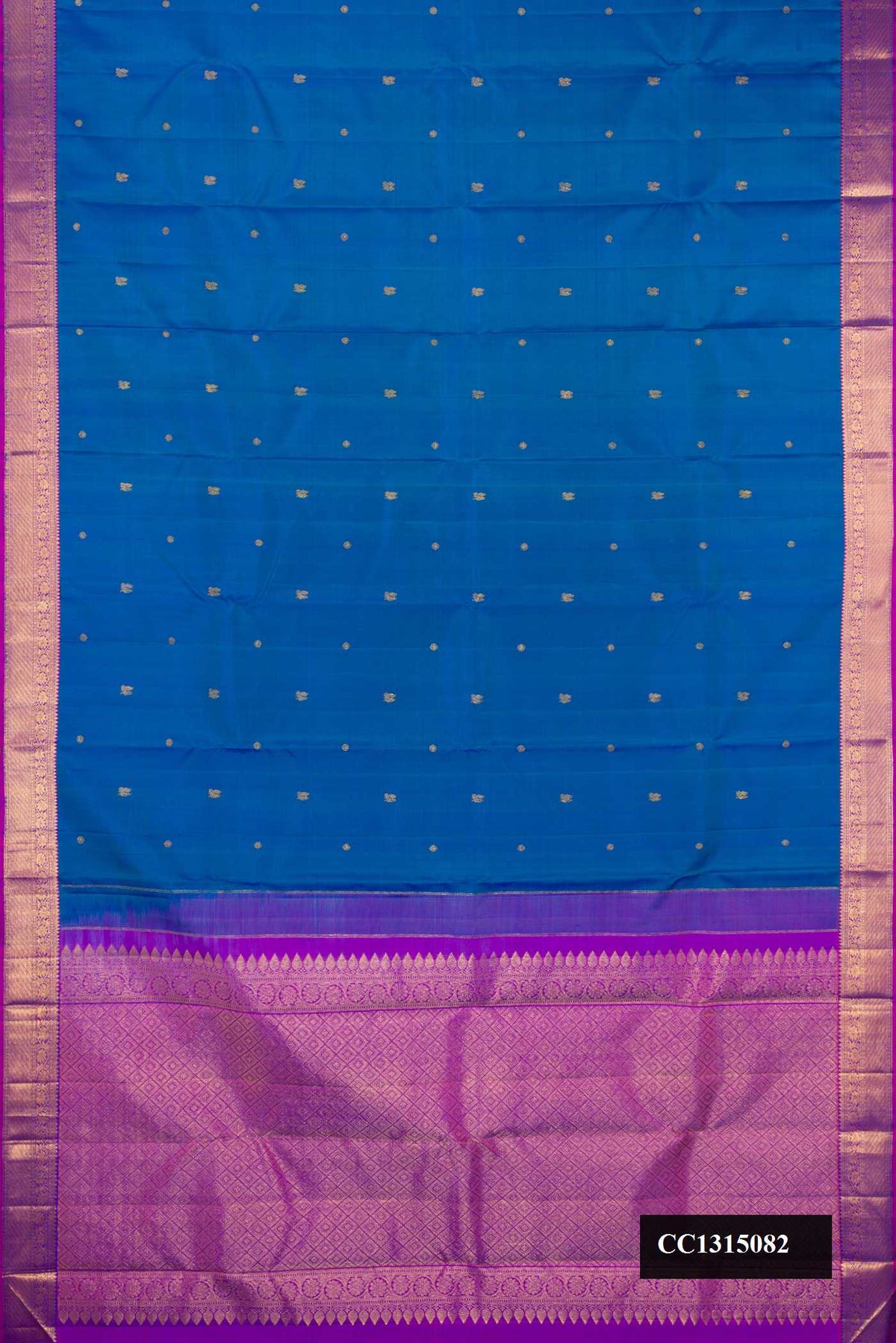 Peacock Blue Dual Tone Kanchipuram Silk Saree with Zari Butta on the body and Zari Border.  displayed on a mannequin