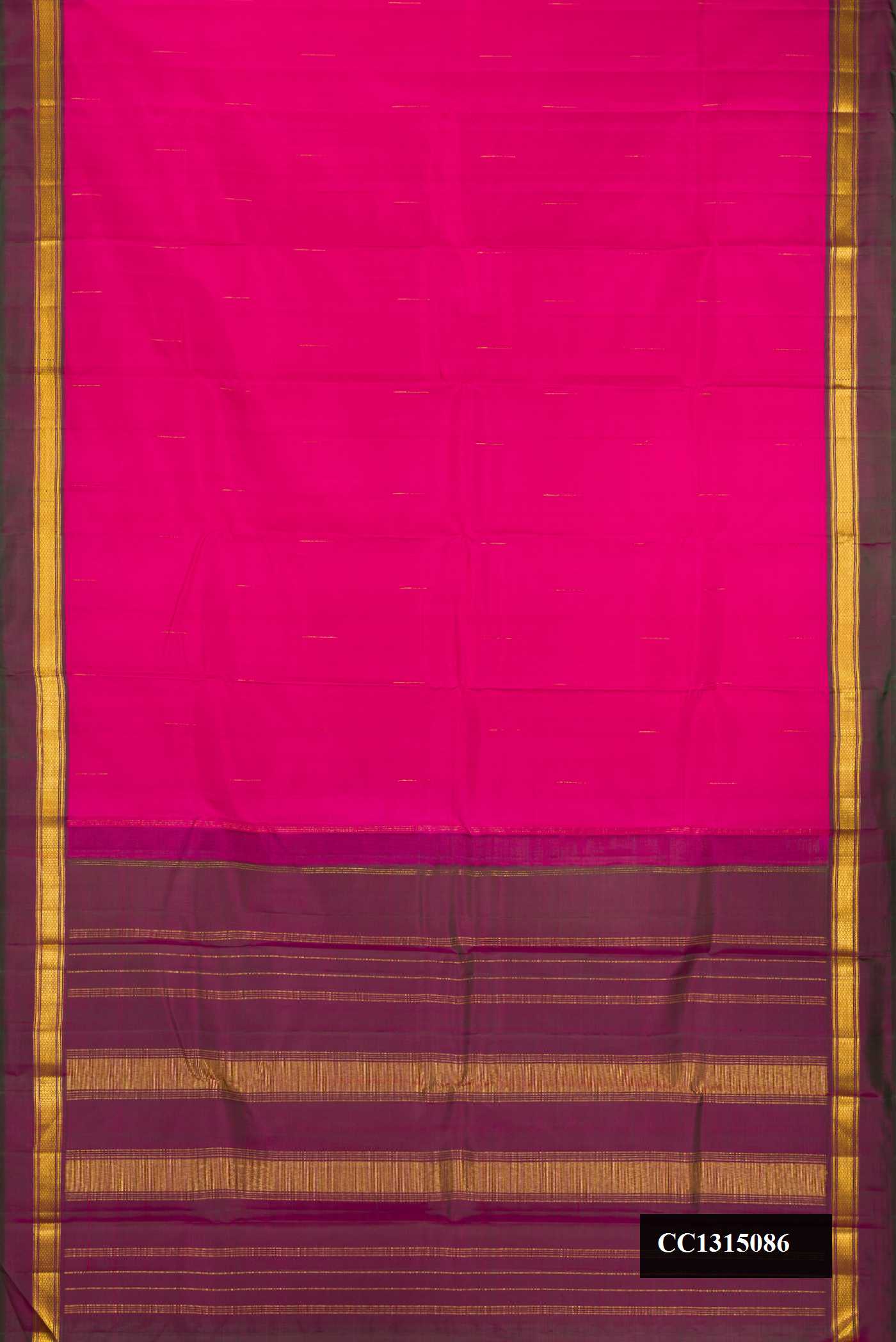 Magenta Dual Tone Kanchipuram Silk Saree with Zari Butta on the body and Zari Border.  displayed on a mannequin