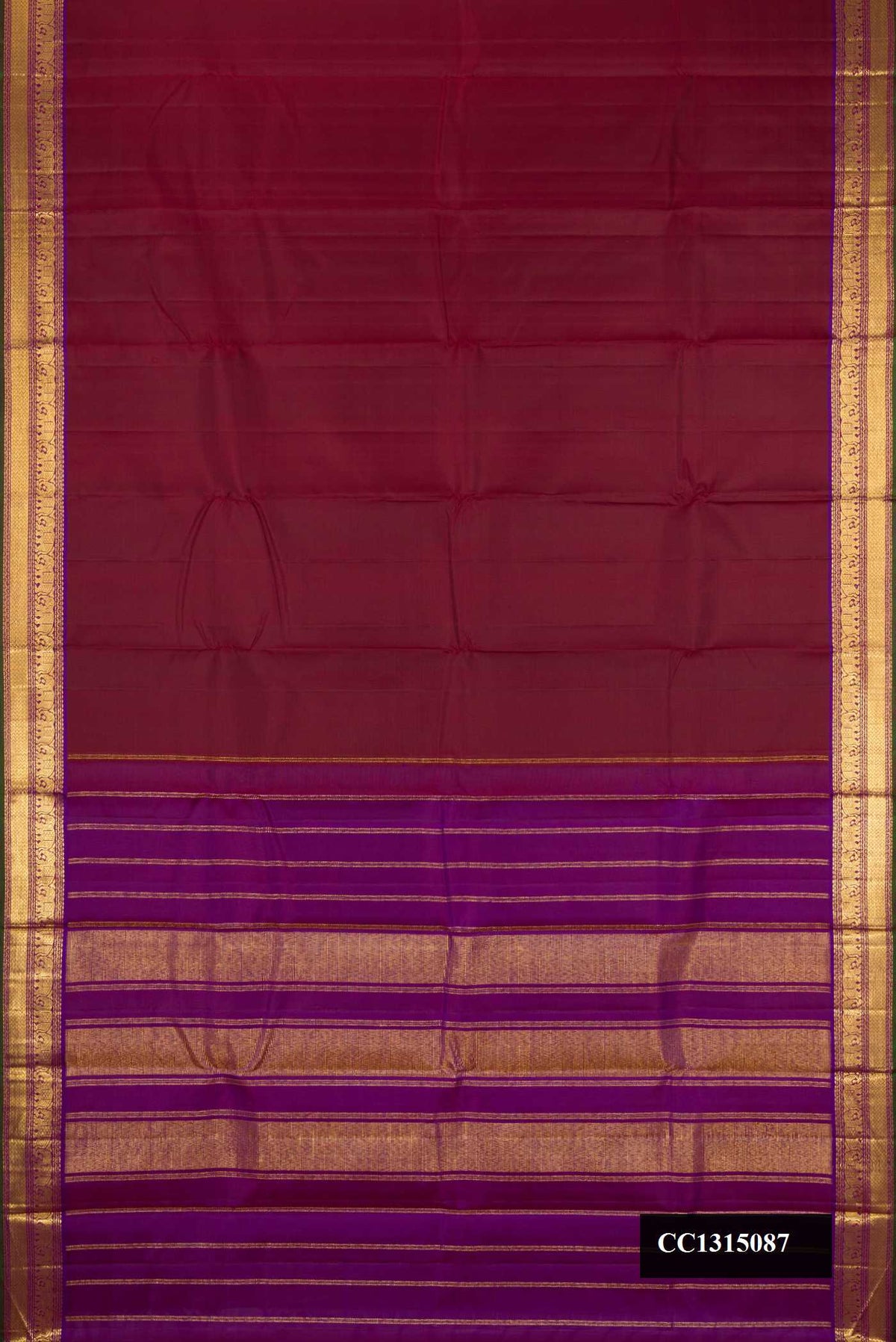 Maroon Dual Tone Kanchipuram Silk Saree with Plain Body and Zari Border.  displayed on a mannequin