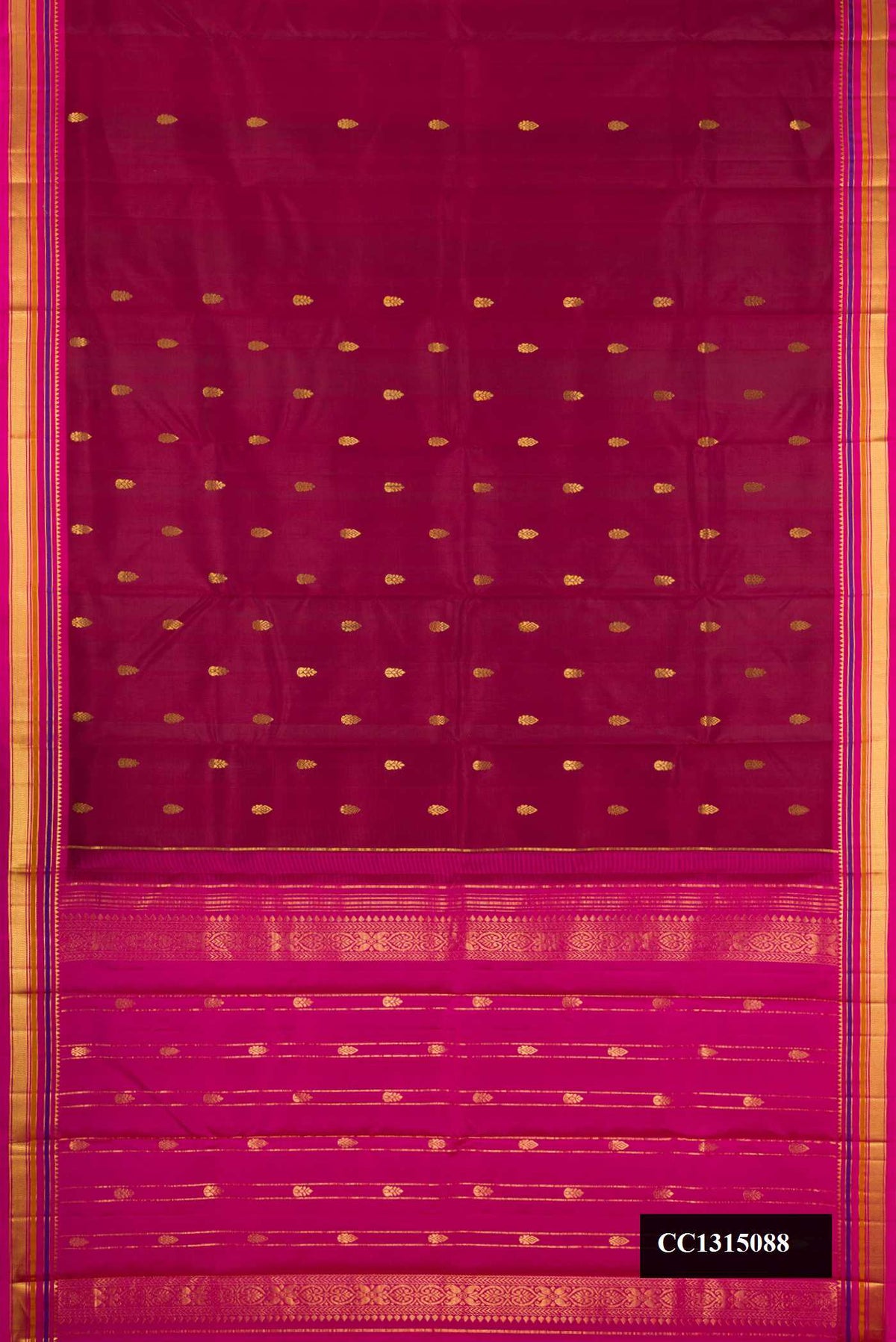 Maroon Dual Tone Kanchipuram Silk Saree with Zari Butta on the body and Zari Border.  displayed on a mannequin
