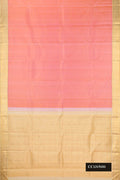 Rose Gold Dual Tone Kanchipuram Silk Saree with Plain Body and Zari Border.  displayed on a mannequin