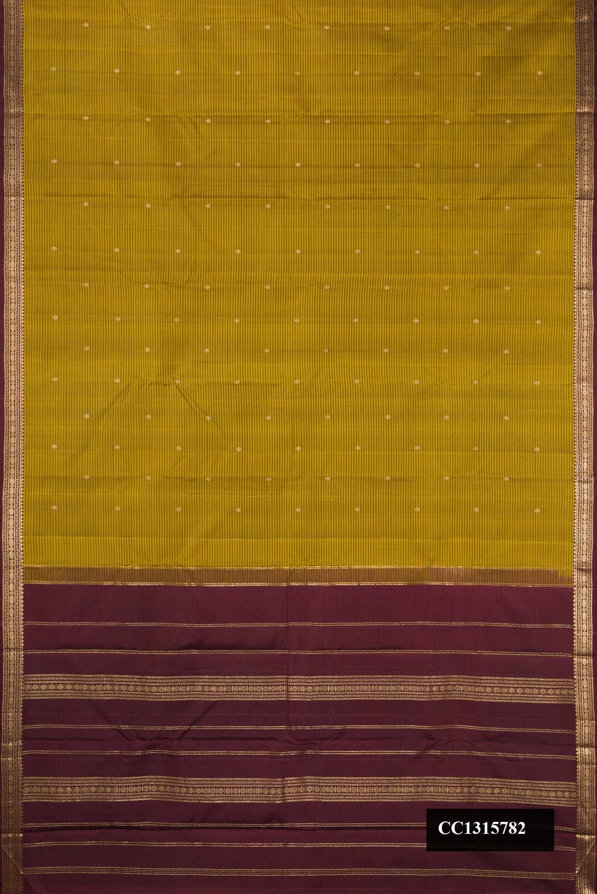 Mehandi Green Dual Tone Kanchipuram Silk Saree with Checked design on the body and Zari Border.  displayed on a mannequin