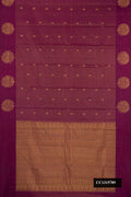 Burgundy Dual Tone Kanchipuram Silk Saree with Stripes on the body and Fancy Border.  displayed on a mannequin