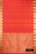 Coral Dual Tone Kanchipuram Silk Saree with Plain Body and Temple Border.  displayed on a mannequin